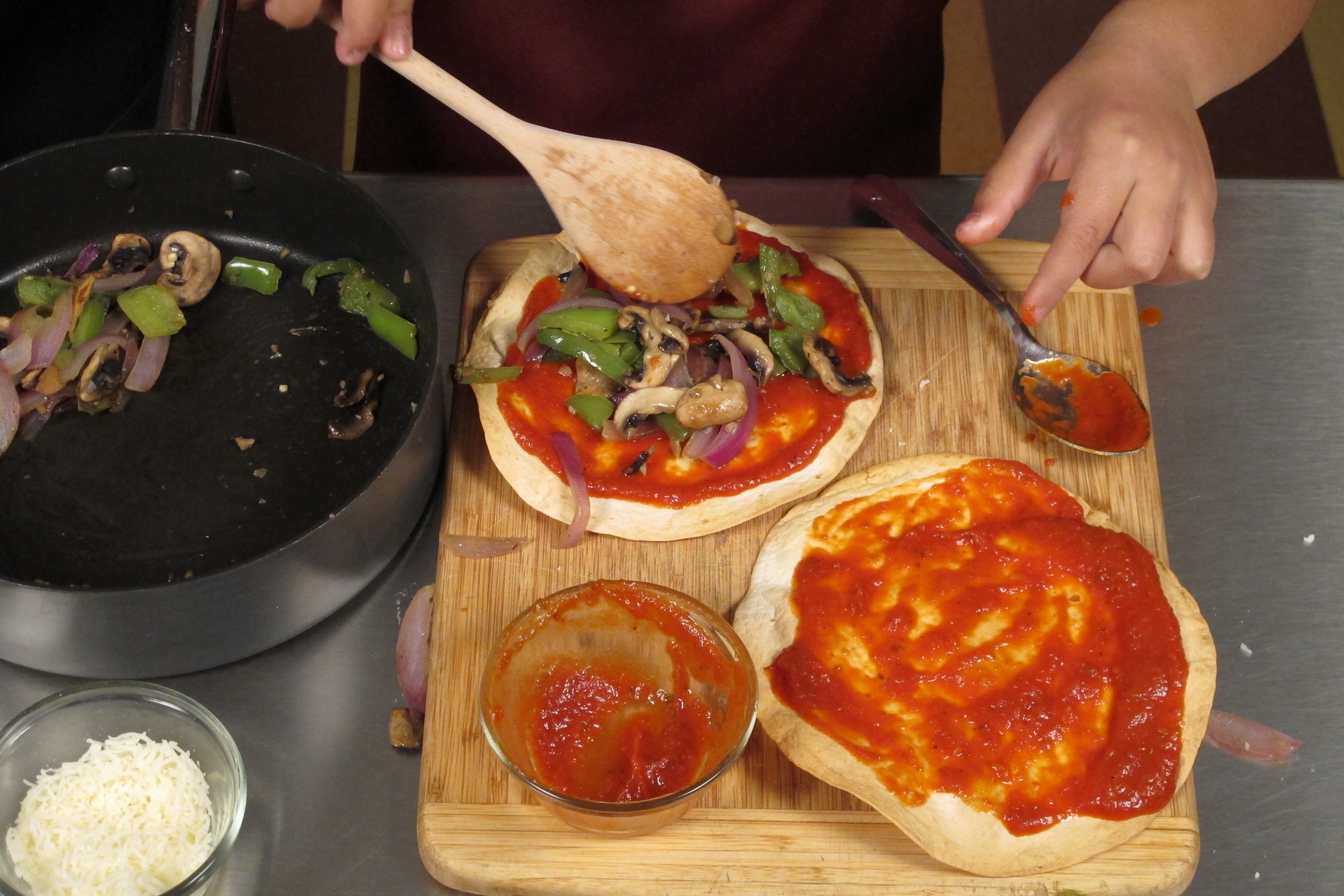 Spread 2 tablespoons of tomato sauce and a bit of the vegetable mixture onto each tortilla crust.